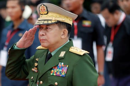 FILE PHOTO: Myanmar's Commander in Chief Senior General Min Aung Hlaing salutes as he attends an event marking Martyrs' Day at Martyrs' Mausoleum in Yangon, Myanmar July 19, 2018.   REUTERS/Ann Wang/File Photo