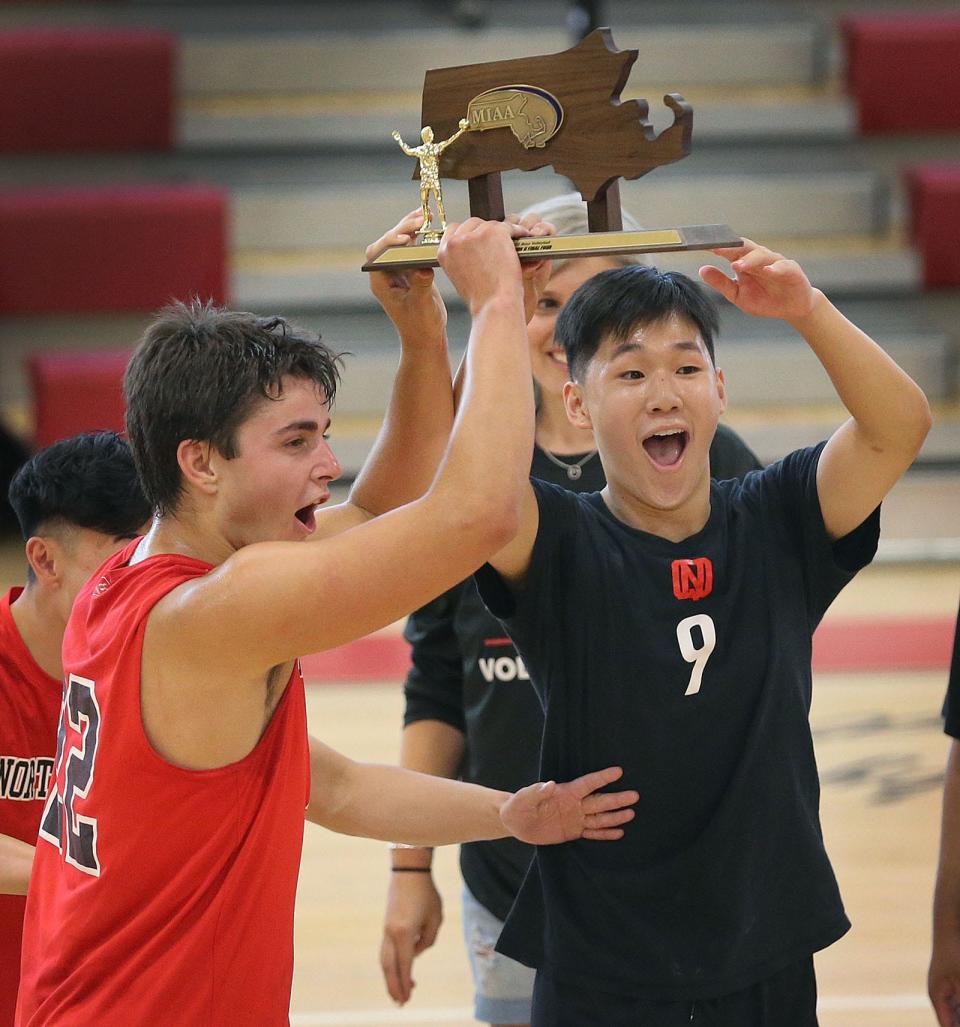 North Quincy players celebrate with a Final Four trophy.