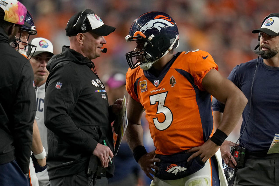 Denver Broncos quarterback Russell Wilson (3) talks with head coach Nathaniel Hackett during the second half of an NFL football game against the Indianapolis Colts, Thursday, Oct. 6, 2022, in Denver. (AP Photo/Jack Dempsey)