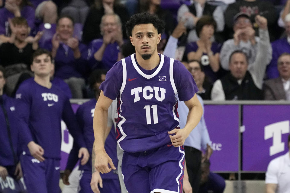 TCU guard Trevian Tennyson runs back down court after sinking a three-point basket in the second half of an NCAA college basketball game against Texas Tech in Fort Worth, Texas, Tuesday, Jan. 30, 2024. (AP Photo/Tony Gutierrez)