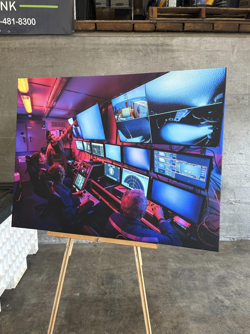 Visual aids for upcoming news conference on the Titan submersible are displayed on Friday, June 30, 2023 in Buffalo, N.Y. The submersible imploded last week, killing all five people on board. (AP Photo/Carolyn Thompson)