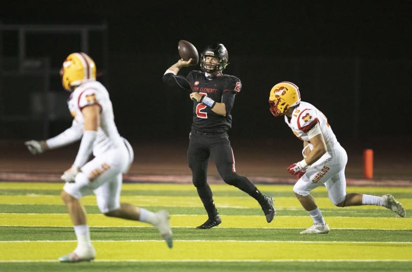 San Clemente, CA - April 16: San Clemente quarterback Lachlan van Rosmalen makes a pass against Mission Viejo at San Clemente High School on Friday, April 16, 2021 in San Clemente, CA. (Allen J. Schaben / Los Angeles Times)