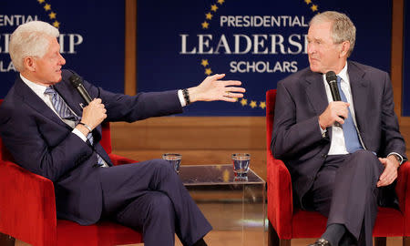 Former U.S. President Bill Clinton (L) and former U.S. President George W. Bush participate in a moderated conversation at the graduation class of the Presidential Leadership Scholars program at the George W. Bush Presidential Library in Dallas, Texas, U.S., July 13, 2017. REUTERS/Brandon Wade