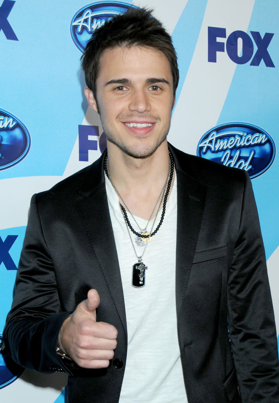 Known for giving his own spins on the songs he performs, Kris Allen beat Adam Lambert and took the Season 8 crown in 2009. (Photo by Gregg DeGuire/FilmMagic)