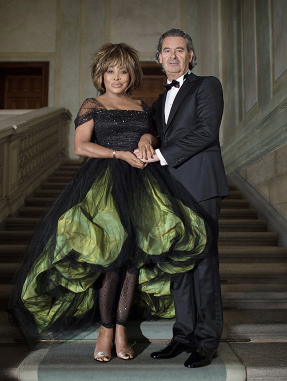 <p>Tina’s long friend Giorgio Armani designed the unique chartreuse taffeta and black silk tulle dress. </p>