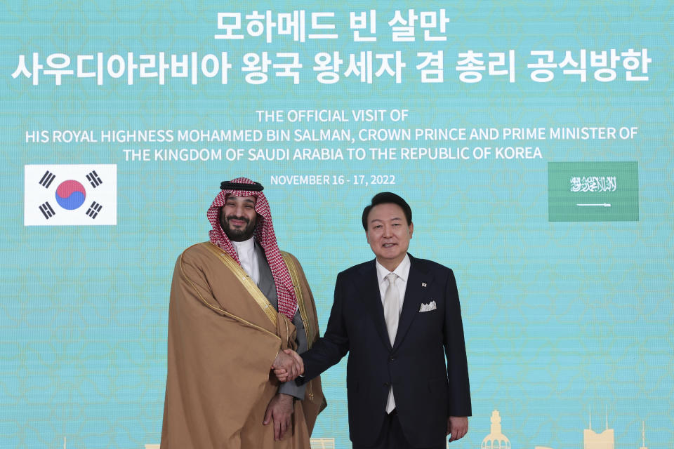 Saudi Arabian Crown Prince Mohammed bin Salman, left, shakes hands with South Korean President Yoon Suk Yeol before a meeting at the presidential residence in Seoul, South Korea, Thursday, Nov. 17, 2022. (South Korean Presidential Office/Yonhap via AP)