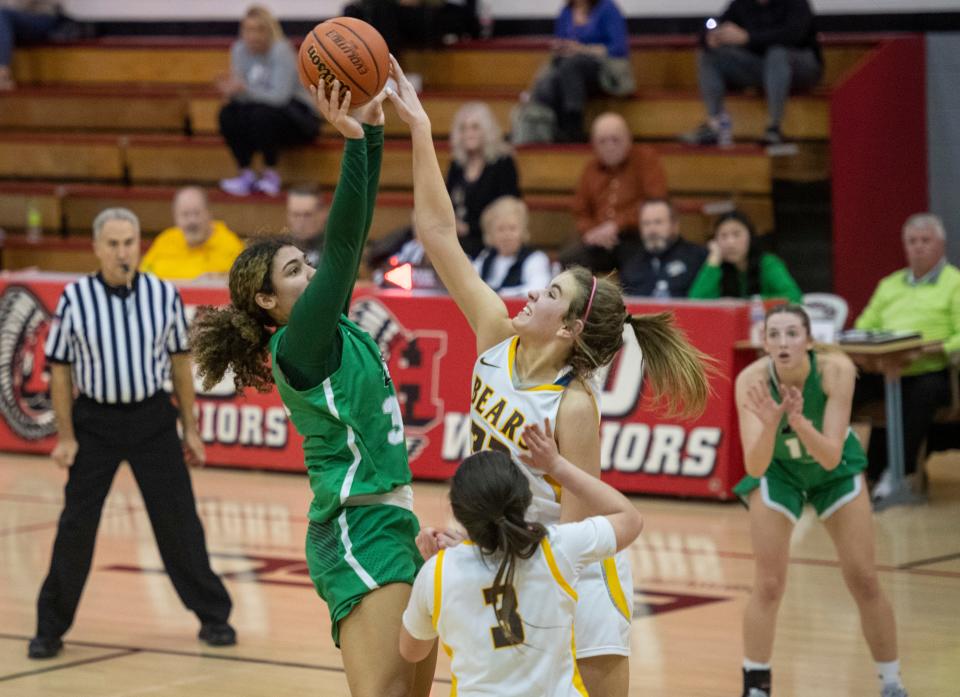 Central's Madalynn Shirley (32) blocks a shot from North’s Jalyn Shelby (30) as the Central Bears play the North Huskies during the semifinal round of the 2023 IHSAA Class 4A Girls Basketball Sectional at Harrison High School in Evansville, Ind., Friday, Feb. 3, 2023. 