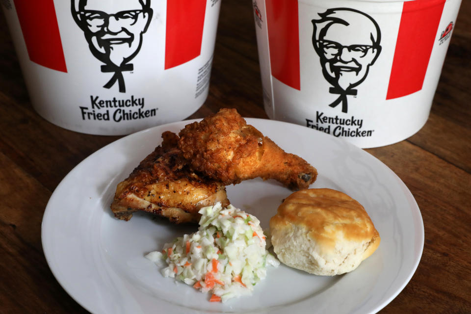 A Kentucky Fried Chicken (KFC) plate of mixed fried and grilled chicken with a biscuit and coleslaw is seen in this picture illustration taken April 6, 2017.   REUTERS/Carlo Allegri