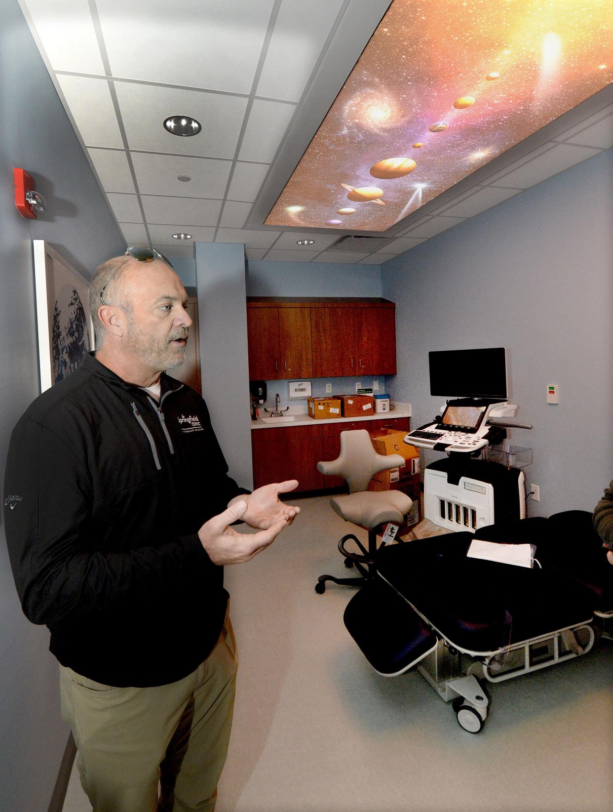 Vice President of Facilities Real-estate and Construction Tom Fitch stand in the Ultrasound room while giving a tour of the new Springfield Clinic Pediatrics Monday, Oct. 9, 2023.