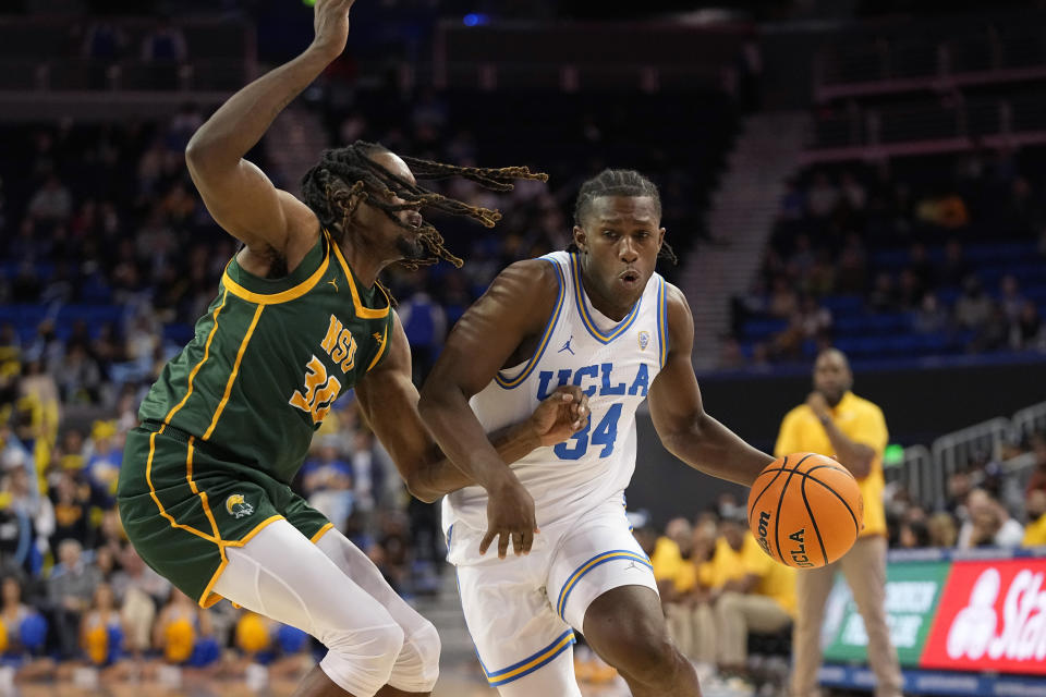 UCLA guard David Singleton, right, drives past Norfolk State forward Kris Bankston during the second half of an NCAA college basketball game Monday, Nov. 14, 2022, in Los Angeles. UCLA won 86-56. (AP Photo/Mark J. Terrill)