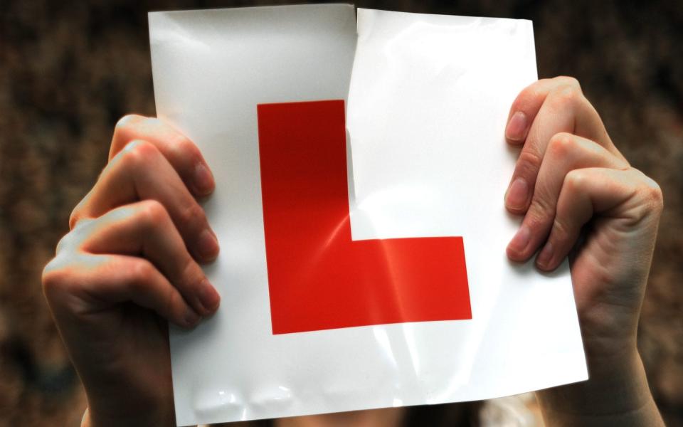 Embargoed to 0001 Saturday July 20 File photo dated 28/07/09 of a learner driver ripping up her L plate. Several learner drivers in the UK have taken the "try, try again" mantra to new levels, according to data from the Driving and Vehicle Standards Agency. PRESS ASSOCIATION Photo. Issue date: Saturday July 20, 2019. A couple of wannabe motorists, whose enthusiasm to pass was seemingly matched only by their consistent ineptitude behind the wheel, racked up at least 20 practical tests in a single calendar year. See PA story TRANSPORT Tests. Photo credit should read: PA/PA Wire Cost Indicator No Cost - PA Wire/PA Wire