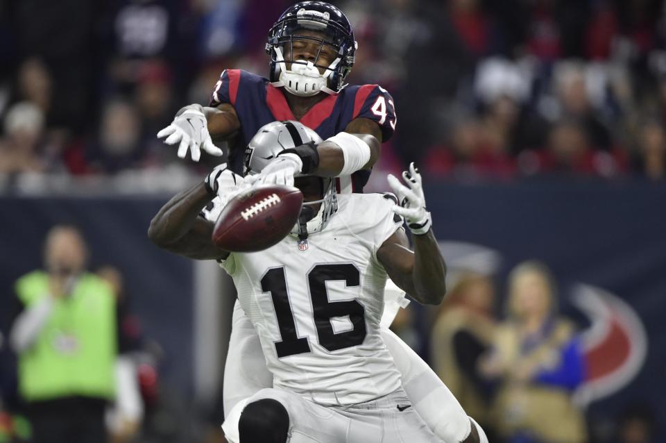 <p>Houston Texans strong safety Corey Moore (43) knocks the ball out of the hands of Oakland Raiders wide receiver Johnny Holton (16) during the fourth quarter of the AFC Wild Card playoff football game at NRG Stadium. Mandatory Credit: Jerome Miron-USA TODAY Sports </p>