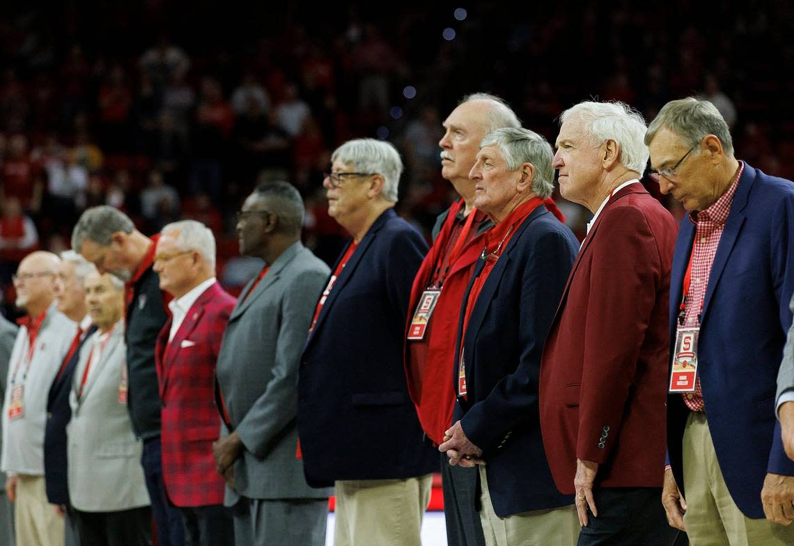 Members of the N.C. State men’s basketball 1974 national championship team are honored during a halftime ceremony on Saturday, Feb. 24, 2024, at PNC Arena in Raleigh, N.C.