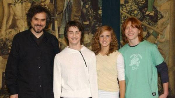 Alfonso Cuarón junto a Daniel Radcliffe, Emma Watson y Rupert Grint