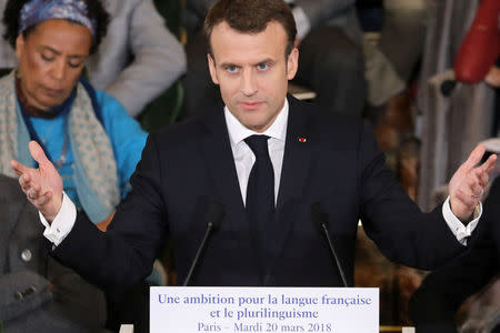 France's President Emmanuel Macron gives a speech to unveil his strategy to promote French language as part of the International Francophonie Day, before members of the French Academy and other guests, at the French Institute in Paris, France, March 20, 2018. Ludovic Marin/Pool via REUTERS
