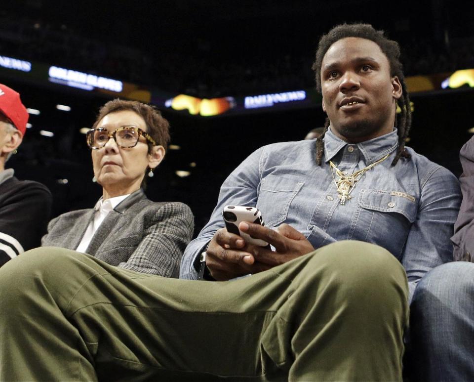 Former Tennessee Titans running back Chris Johnson watches the second half of an NBA basketball game between the New York Knicks and the Brooklyn Nets Tuesday, April 15, 2014, in New York. The The Knicks won 109-98. (AP Photo/Frank Franklin II)