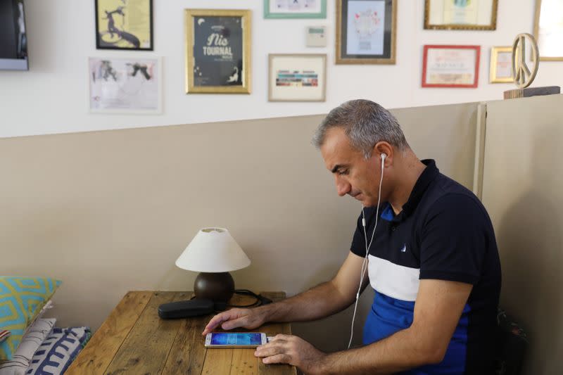 Omid Tootian, an Iranian musician, sits in a cafe in the UN buffer zone at Ledra Palace in Nicosia