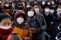 Buddhist believers pray for their children’s success in the college entrance examinations amid the coronavirus disease (COVID-19) pandemic, at a Buddhist temple in Seoul