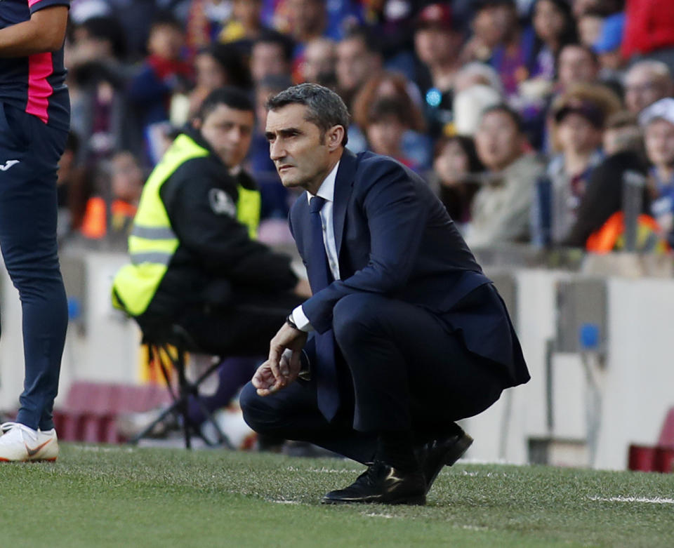 Barcelona coach Ernesto Valverde looks at the game during the Spanish La Liga soccer match between FC Barcelona and Getafe at the Camp Nou stadium in Barcelona, Spain, Sunday, May 12, 2019. (AP Photo)