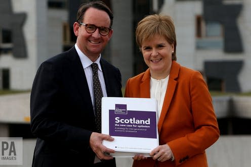 <span class="caption">Sustainable Growth Commission chairman Andrew Wilson presents his report to Nicola Sturgeon. </span> <span class="attribution"><span class="source">PA/Gordon Terrace</span></span>