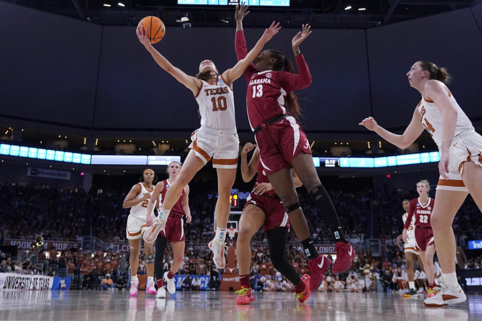 Texas guard Shay Holle (10) drives to the basket against Alabama center JeAnna Cunningham (13) during the first half of a second-round college basketball game in the women’s NCAA Tournament in Austin, Texas, Sunday, March 24, 2024. (AP Photo/Eric Gay)