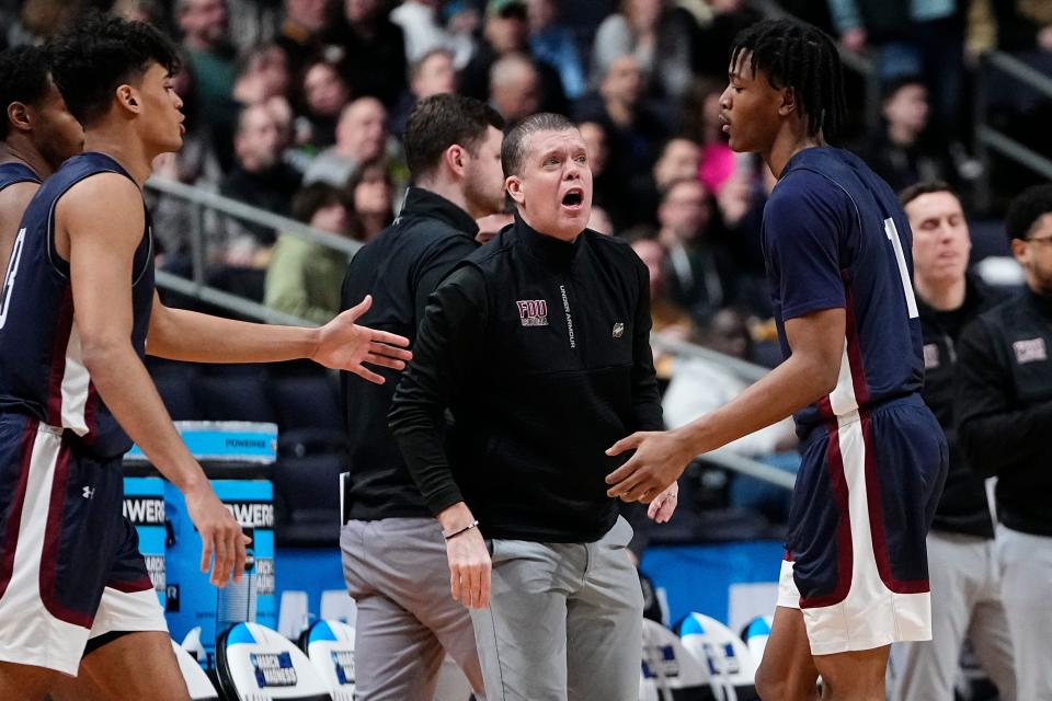 Mar 17, 2023; Columbus, Ohio, USA;  Fairleigh Dickinson Knights head coach Tobin Anderson talks to guard Joe Munden Jr. (1) during the first round of the NCAA menâ€™s basketball tournament against the Purdue Boilermakers at Nationwide Arena. Marquette won 78-61. Mandatory Credit: Adam Cairns-The Columbus Dispatch

Basketball Ncaa Men S Basketball Tournament