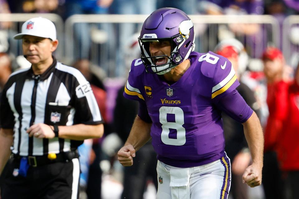 Kirk Cousins #8 of the Minnesota Vikings celebrates a touchdown during the second quarter against the Arizona Cardinals at U.S. Bank Stadium on October 30, 2022 in Minneapolis, Minnesota.