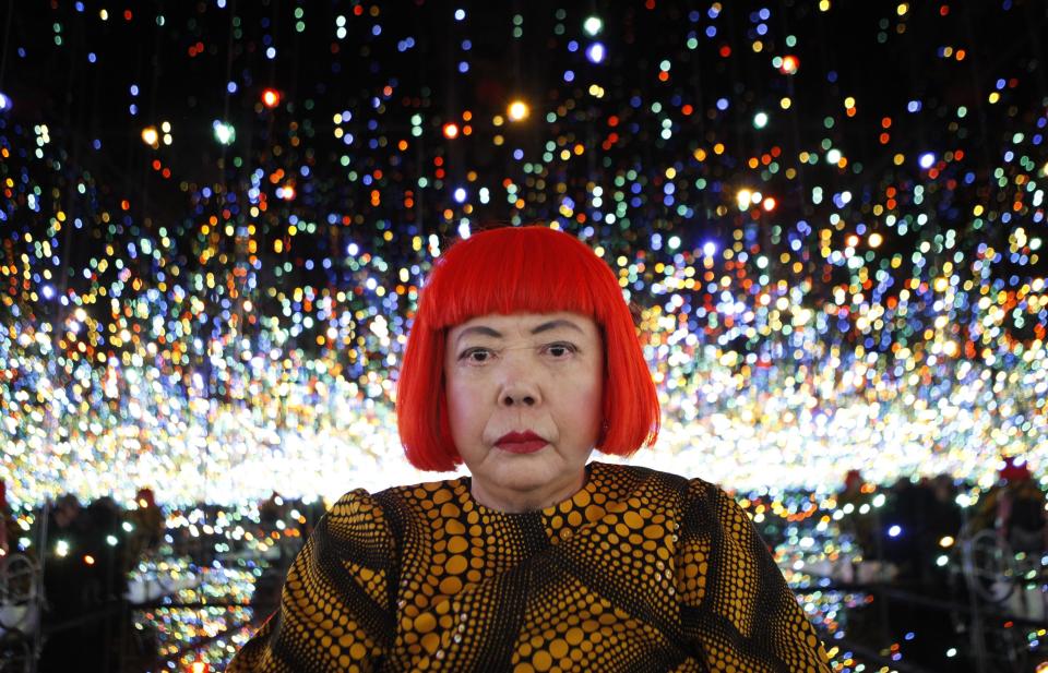 RNPS - PICTURES OF THE YEAR 2013 - Japanese artist Yayoi Kusama poses for a photograph inside her Infinity Mirrored Room installation titled "The Souls of Millions of Light Years Away" during a media preview of her new exhibition at the David Zwirner gallery in New York November 7, 2013. The exhibition, titled "I Who Have Arrived in Heaven", features two mirrored rooms, a video installation and over 30 new large-scale paintings highlighting her unique amalgamation of representational and non-representational subject matter. The exhibition ran from November 8 to December 21. REUTERS/Mike Segar (UNITED STATES - Tags: SOCIETY PROFILE TPX)