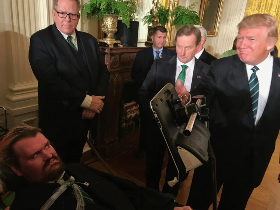 In this photo provided by Sayreville Mayor Kennedy O'Brien, President Donald Trump, right, greets Patrick Sean O'Brien, who suffers from amyotrophic laterals sclerosis, or ALS, at the White House on Thursday, March 16, 2017, in Washington. Sayreville Mayor Kennedy O'Brien says the White House "moved heaven and earth" to get his 42-year-old son to Thursday night's dinner with Trump and Irish Prime Minister Enda Kenny. (Kennedy O'Brien via AP)