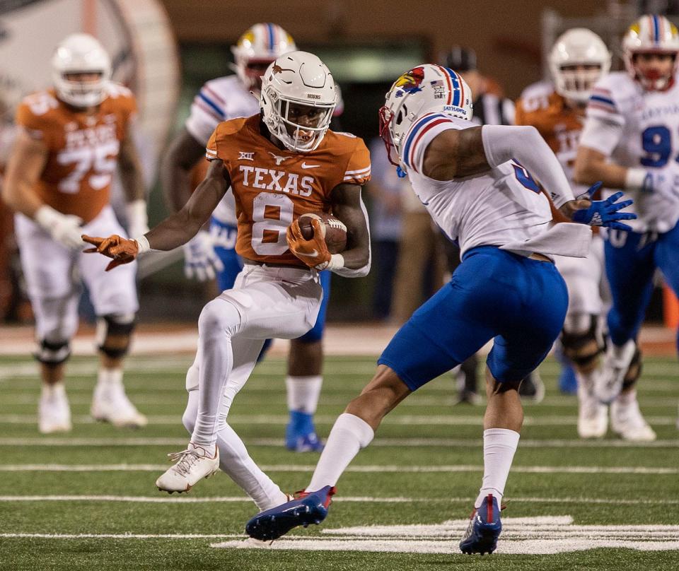 Texas wide receiver Xavier Worthy turns for more yards during last year's game against Kansas. The Longhorns open fall camp Wednesday in advance of their Sept. 3 opener against Louisiana-Monroe.
