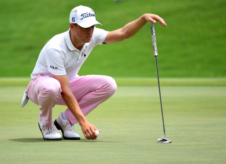 Aug 2, 2020; Memphis, Tennessee, USA; Justin Thomas lines up his putt on the first green during the final round of the WGC - FedEx St. Jude Invitational golf tournament at TPC Southwind. Mandatory Credit: Christopher Hanewinckel-USA TODAY Sports