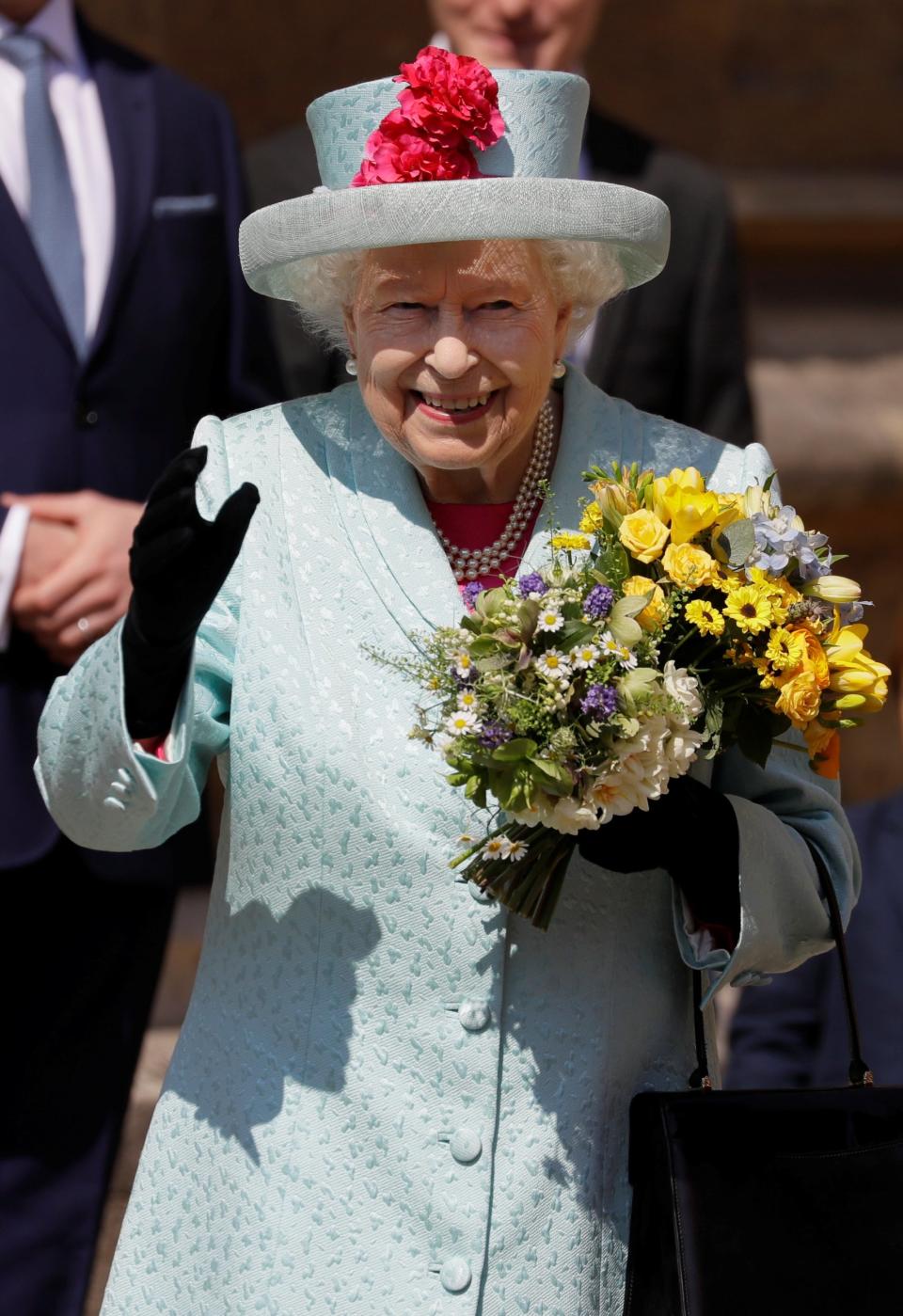 Queen Elizabeth II waves as she leaves the Easter Mattins Service at St George's Chapel (REUTERS)