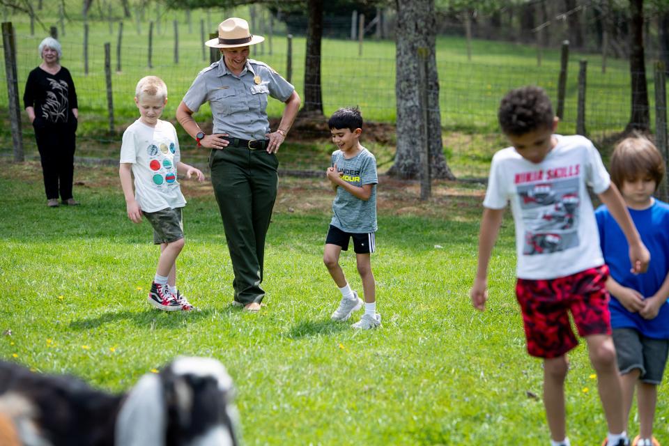 Shalyn Yost answers questions from curious children visiting the Carl Sandburg Home during a spring break day camp, April 2, 2024l.