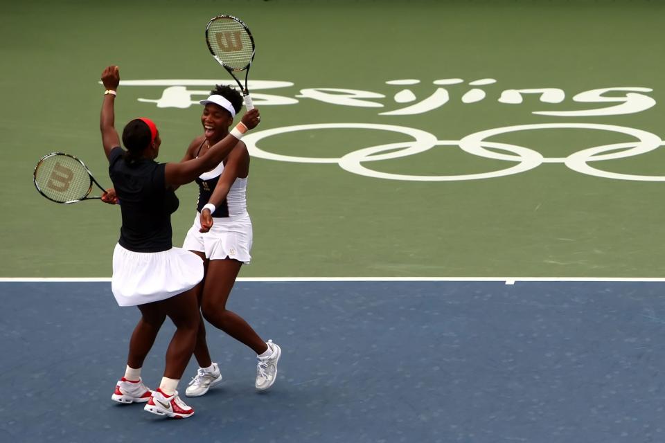<p>Serena Williams and Venus Williams of the United States celebrate winning the gold medal over Virginia Ruano Pascual and Anabel Medina Garrigues of Spain in the Women’s Doubles gold medal match held at the Olympic Green Tennis Center during Day 9 of the Beijing 2008 Olympic Games on August 17, 2008 in Beijing, China. (Photo by Clive Rose/Getty Images) </p>