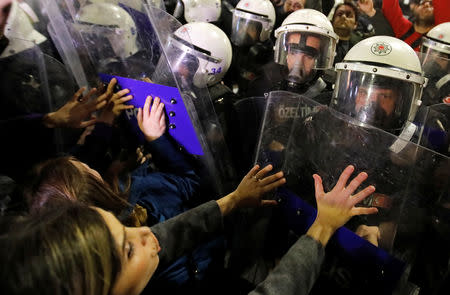 Police try to disperse a march marking International Women's Day in Istanbul, Turkey, March 8, 2019. REUTERS/Kemal Aslan