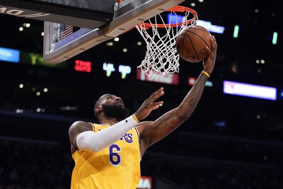 Los Angeles Lakers forward LeBron James (6) shoots during the first half of an NBA basketball game against the Indiana Pacers in Los Angeles, Wednesday, Jan. 19, 2022. (AP Photo/Ashley Landis)