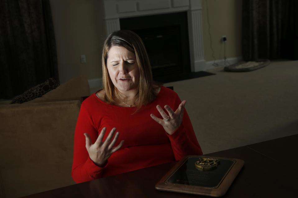 In this March 14, 2014 photo, Nicole Lynch, sister of slain Massachusetts Institute of Technology police officer Sean Collier, speaks during an interview at her home in Dracut, Mass. Collier was allegedly killed by the two suspects in the Boston Marathon bombings on April 19, 2013. Lynch still mourns her brother and will be at the 2014 race with Team Collier Strong to raise money for a scholarship fund to put one person a year through law enforcement training. (AP Photo/Elise Amendola)