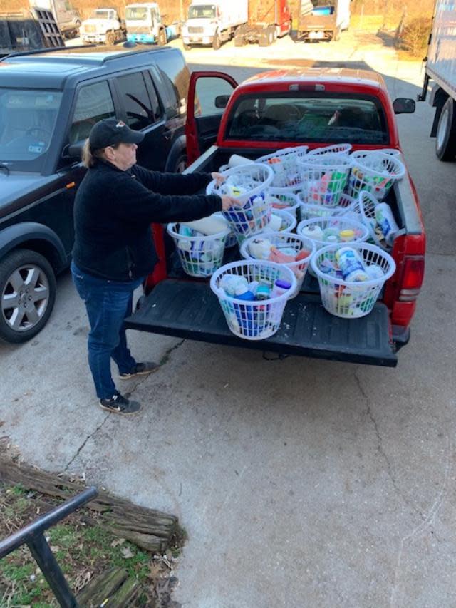 Kim Parigrin Cantrell loads a truck with items destined for people in need.