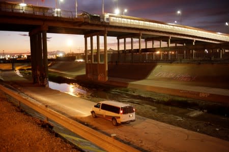 A vehicle of the National Migration Institute (INM) patrols along the Rio Bravo river as part of an ongoing operation to prevent migrants from crossing illegally into the United States, in Ciudad Juarez