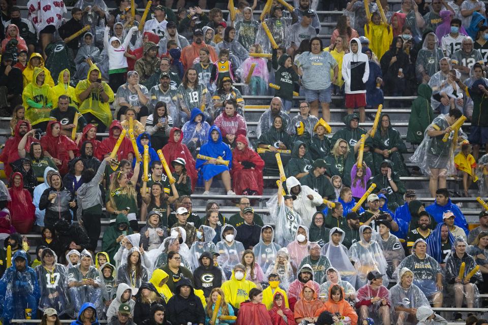 Fans brave the rain during Packers Family Night at Lambeau Field, Aug. 7, 2021, in Green Bay. Rain and storms visited Family Night over the event's previous 21 years, but mostly it's been dry.