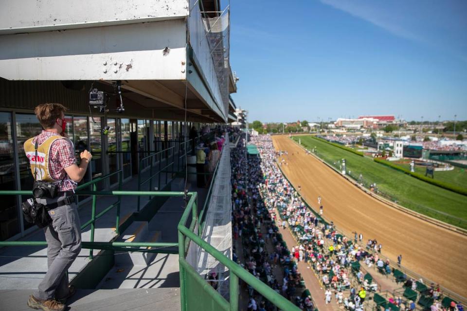 Herald-Leader photographer Silas Walker sets up a remote camera on Millionaires Row at Churchill Downs. Ryan Hermens/rhermens@herald-leader.com