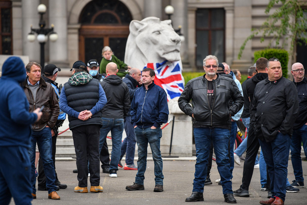 GLASGOW, SCOTLAND - JUNE 13: Activists gather at the cenotaph in George Square to protect it from any vandalism attacks on June 13, 2020 in Glasgow, Scotland. The Loyalist Defence League has asked followers to gather in George Square today for a 'protect the Cenotaph' event in response to statues being defaced across Scotland following BLM demonstrations. (Photo by Jeff J Mitchell/Getty Images)