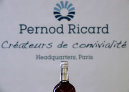 FILE PHOTO: A logo is seen on a bottle of the Ricard aniseed-flavoured beverage displayed during French drinks maker Pernod Ricard news conference to announce the company annual results in Paris, France, August 29, 2018. REUTERS/Christian Hartmann
