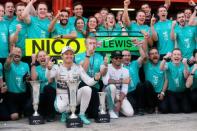 Formula One - F1 - Spanish Grand Prix 2015 - Circuit de Catalunya, Barcelona, Spain - 10/5/15 Mercedes' Nico Rosberg and Lewis Hamilton celebrate after finishing first and second respectively with their team Reuters / Albert Gea