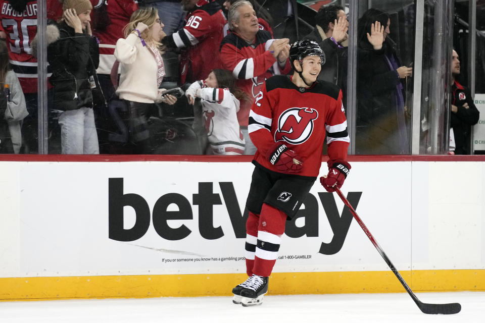 New Jersey Devils' Curtis Lazar smiles after scoring the winning goal during the third period of an NHL hockey game against the New York Islanders in Newark, N.J., Tuesday, Nov. 28, 2023. The Devils defeated the Islanders 5-4. (AP Photo/Seth Wenig)