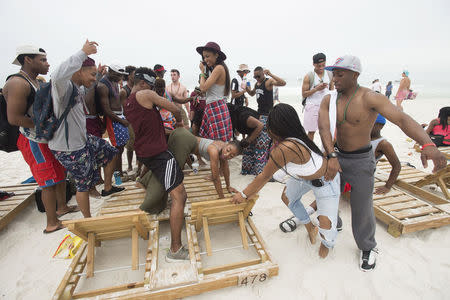 People gather to twerk during spring break festivities in Panama City Beach, Florida March 12, 2015.REUTERS/Michael Spooneybarger