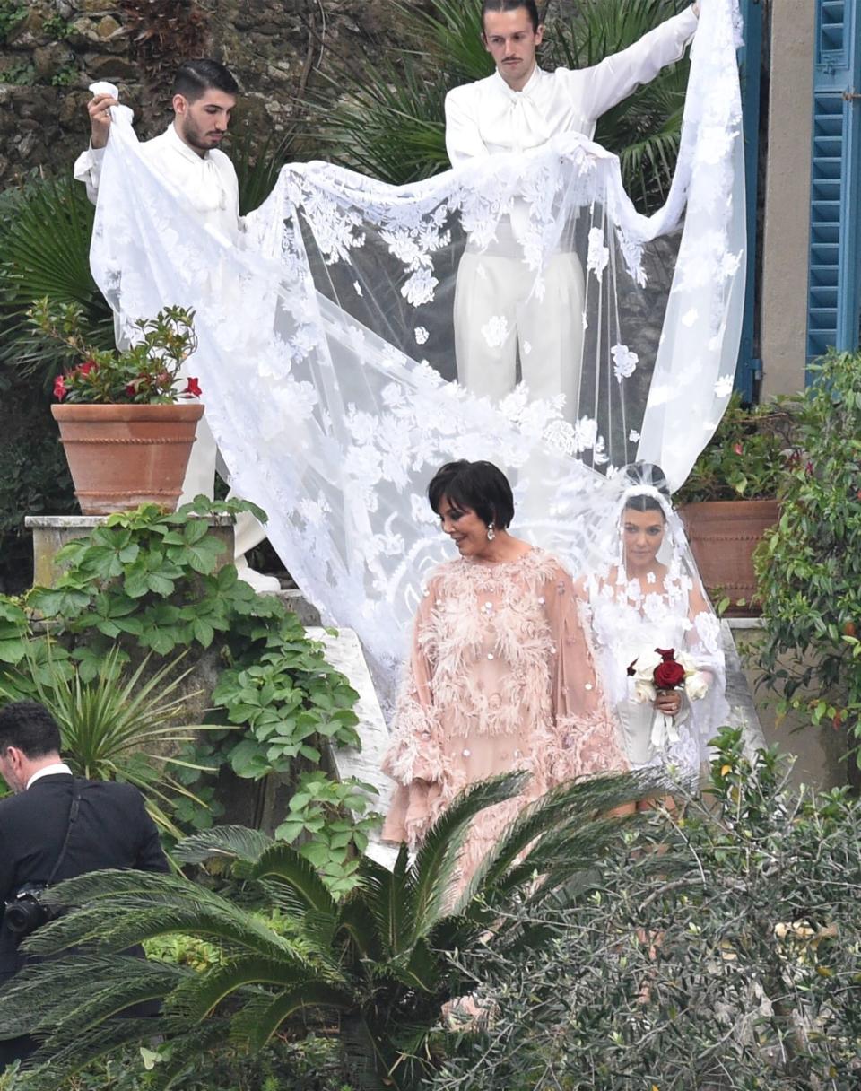 portofino, ITALY - *EXCLUSIVE* - Here Comes the Bride!! Kourtney Kardashian is seen being guided to her wedding by mother Kris. Pictured: Kourtney Kardashian BACKGRID USA 22 MAY 2022 BYLINE MUST READ: Cobra Team / BACKGRID USA: +1 310 798 9111 / usasales@backgrid.com UK: +44 208 344 2007 / uksales@backgrid.com *UK Clients - Pictures Containing Children Please Pixelate Face Prior To Publication*