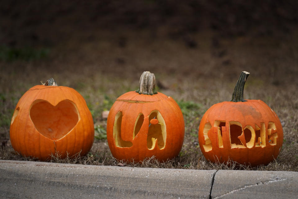 Carved pumpkins express support for the Lewiston/Auburn community in the wake of this week's mass shootings, Saturday, Oct. 28, 2023, in Lewiston, Maine. A gunman killed several people at a bowling alley and a bar in Lewiston on Wednesday. (AP Photo/Robert F. Bukaty)