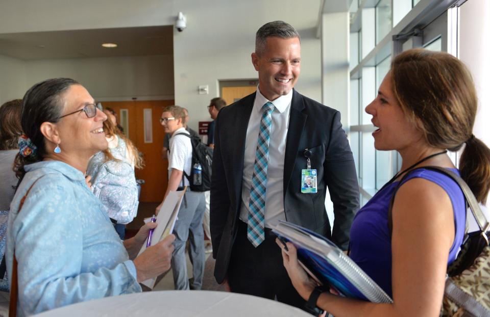 Sarasota County School District Superintendent Terry Connor, center, speaks with Venice Middle School arts teachers Lisa Jodwalis (visual arts), left, and Tatiana Ignotis (theater), right, before the start of the Aug. 7, 2023, Arts Teachers Pre-planning Professional Learning conference at Riverview High School.