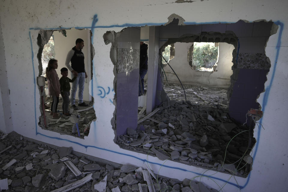 Palestinians check demolished home in the West Bank village of Silat al-Harithiya, near Jenin, Saturday, May 7, 2022. Israeli forces demolished a home of Omar Jaradat who was part of a group who shot and yeshiva student Yehuda Dimentman in the West Bank in December 2021. (AP Photo/Majdi Mohammed)